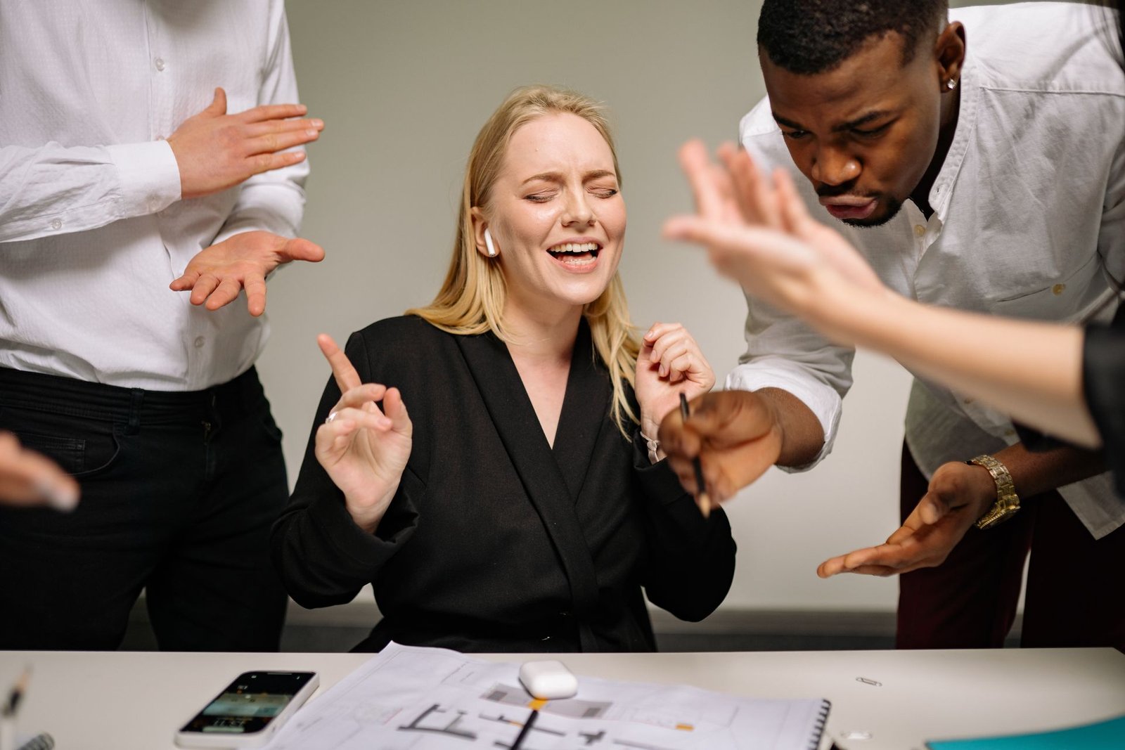 Outsourced project manager reviewing delivery status with stakeholders